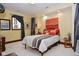 Cozy bedroom featuring a comfortable bed with stylish linens and decor, with neutral walls and window at 5528 State Road 144, Greenwood, IN 46143