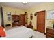 Charming bedroom with wood trim, comfortable bed, decor and dual closets with wood doors at 5528 State Road 144, Greenwood, IN 46143