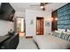 Bright bedroom showcasing a modern headboard, stylish accents, and an open doorway at 5528 State Road 144, Greenwood, IN 46143