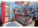 Bedroom featuring a comfortable bed, a bright window with curtains, and decor, creating a welcoming space at 5528 State Road 144, Greenwood, IN 46143