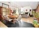 The dining area showcases modern lighting and transitions into a cozy living room, perfect for gatherings and everyday living at 5528 State Road 144, Greenwood, IN 46143