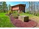 Modern home with a three-car garage, set in a landscape of mature trees and flowering gardens at 5528 State Road 144, Greenwood, IN 46143