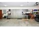 Spacious garage with an abundance of cabinet storage and epoxied floors at 5528 State Road 144, Greenwood, IN 46143
