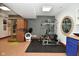 Home gym features a sauna, weightlifting machine, and exercise equipment for a complete fitness experience in your own home at 5528 State Road 144, Greenwood, IN 46143