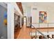 Upstairs hallway with recessed lighting and artwork, leading to additional rooms in the home at 5528 State Road 144, Greenwood, IN 46143