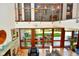 Cozy living room with fireplace, expansive windows overlooking the backyard, and stylish contemporary furnishings at 5528 State Road 144, Greenwood, IN 46143