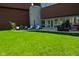 Lovely patio with a blue umbrella, with a grill and an outdoor dining area at 5528 State Road 144, Greenwood, IN 46143
