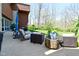 A patio with comfortable outdoor seating and landscaping creates a serene outdoor living space at 5528 State Road 144, Greenwood, IN 46143