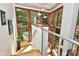 Staircase landing featuring a corner with expansive windows and natural lighting at 5528 State Road 144, Greenwood, IN 46143