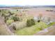 Wide aerial view of homes surrounded by a mix of greenery and open fields at 5541 S County Road 150 E, Clayton, IN 46118