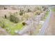 Aerial view shows homes with spacious yards and surrounding trees at 5541 S County Road 150 E, Clayton, IN 46118