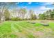 Expansive backyard with mature trees and lawn at 5541 S County Road 150 E, Clayton, IN 46118