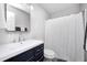 Bathroom featuring a modern vanity, mirror, toilet, and shower with a curtain at 5541 S County Road 150 E, Clayton, IN 46118