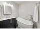 Bathroom featuring a standalone tub and modern vanity at 5541 S County Road 150 E, Clayton, IN 46118