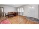 Spacious dining room with wood floors, a large table, and a charming vintage display cabinet at 5541 S County Road 150 E, Clayton, IN 46118