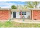 Charming front entrance with a black door, decorative wreath, and seating for relaxation at 5541 S County Road 150 E, Clayton, IN 46118