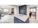 Open kitchen concept with modern appliances, granite countertops, and hardwood floors at 5541 S County Road 150 E, Clayton, IN 46118