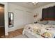 Bright bedroom with hardwood floors features a ceiling fan and neutral walls at 5693 W Walnut St, Greenwood, IN 46142