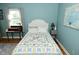 Bedroom with charming bed, a desk near the window and light blue walls, exuding cozy elegance at 5693 W Walnut St, Greenwood, IN 46142