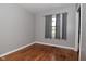 Serene bedroom with hardwood floors, a neutral color scheme, and natural light at 5693 W Walnut St, Greenwood, IN 46142