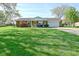 Charming brick ranch-style home with well-manicured lawn and attached one car garage at 5693 W Walnut St, Greenwood, IN 46142