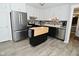 Modern kitchen featuring stainless steel appliances, stylish backsplash, black lower cabinets and white upper cabinets at 5693 W Walnut St, Greenwood, IN 46142