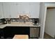 Updated kitchen featuring white cabinets, modern appliances, a stylish backsplash, and plenty of counter space at 5693 W Walnut St, Greenwood, IN 46142