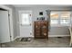 Cozy area showcasing a classic wooden cabinet, a microwave, and a doorway to the yard at 5693 W Walnut St, Greenwood, IN 46142