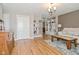 Spacious living room featuring hardwood floors, built-in shelving, and neutral paint colors at 5693 W Walnut St, Greenwood, IN 46142