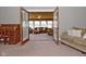Open living room and sunroom is perfect for entertaining friends at 5693 W Walnut St, Greenwood, IN 46142