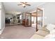 Spacious and open living room with natural light showcases views into the dining room at 5693 W Walnut St, Greenwood, IN 46142