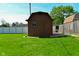 Exterior view of the shed with double doors and a manicured lawn at 5693 W Walnut St, Greenwood, IN 46142