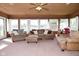 Relaxing sunroom filled with natural light and ample seating at 5693 W Walnut St, Greenwood, IN 46142