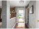 Inviting foyer with decorative rug and gray accent wall with views to the outside at 5886 N Peppereel Way, McCordsville, IN 46055
