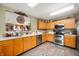 Well-lit kitchen with ample counter space, stainless steel appliances, and a modern feel at 5886 N Peppereel Way, McCordsville, IN 46055