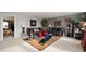 Open-concept living room with neutral tones, ample seating, and modern decor at 5886 N Peppereel Way, McCordsville, IN 46055