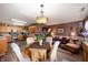 Open concept living space connecting the kitchen, living, and dining areas for easy entertaining at 5886 N Peppereel Way, McCordsville, IN 46055