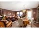 Comfortable living and dining area filled with natural light and warm, inviting decor at 5886 N Peppereel Way, McCordsville, IN 46055