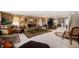 Spacious living room featuring neutral carpet and decorative furniture and curtains at 5886 N Peppereel Way, McCordsville, IN 46055