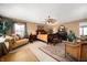 Cozy primary bedroom with a ceiling fan, sitting area, and natural light at 5886 N Peppereel Way, McCordsville, IN 46055