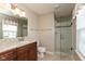 Bright bathroom with granite counters, updated vanity, and glass-enclosed shower at 6075 Bristlecone Dr, Fishers, IN 46038