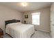 Serene bedroom with natural light, neutral paint, and carpeted floor at 6075 Bristlecone Dr, Fishers, IN 46038