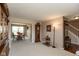 Cozy dining area with beige walls, white carpet, wooden furniture, and open floor concept at 6075 Bristlecone Dr, Fishers, IN 46038