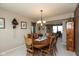 Inviting dining room with wood table, chandelier, and neutral decor, perfect for Gathering meals and entertaining at 6075 Bristlecone Dr, Fishers, IN 46038
