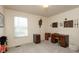 Functional home office with a neutral color scheme, built-in desk, and good natural light at 6075 Bristlecone Dr, Fishers, IN 46038