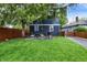 Well-kept backyard with a grill and dining set offering a cozy outdoor experience at 6106 Evanston Ave, Indianapolis, IN 46220