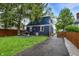 Expansive backyard, showcasing a grill and dining area perfect for entertaining guests at 6106 Evanston Ave, Indianapolis, IN 46220