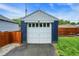 A well-maintained garage with a white door entrance, offering secure parking and storage at 6106 Evanston Ave, Indianapolis, IN 46220