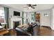 Inviting living room with a fireplace, hardwood floors, and a comfortable seating area at 6106 Evanston Ave, Indianapolis, IN 46220