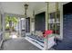 Relaxing screened-in porch with a cozy porch swing and decorative pillows at 6106 Evanston Ave, Indianapolis, IN 46220